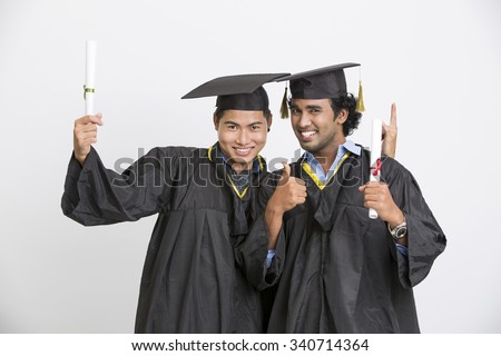 Cheerful happy two male graduates, isolated on white background.