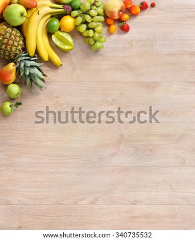 Organic fruits background / studio photography of different fruits on old wooden table. High resolution product.