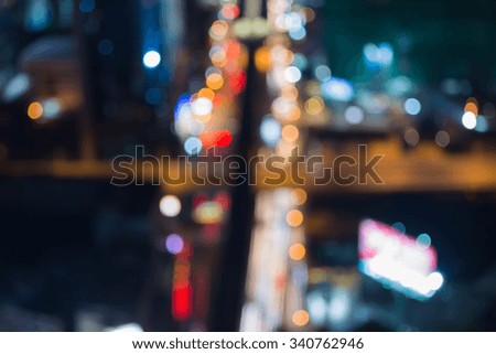 Blurred bokeh city road intersection at night