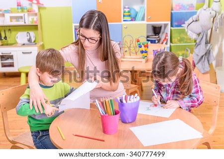 kindergarten art class - two kids and teacher