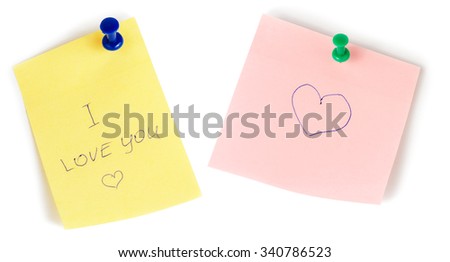 Yellow and pink note papers with push and heart isolated on white background. I love you.