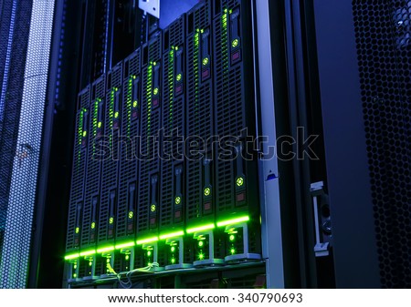rack with blade behind bars mainframe in the data center Royalty-Free Stock Photo #340790693