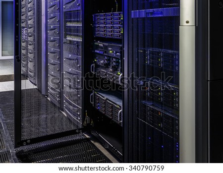 room with rows of server hardware in data center Royalty-Free Stock Photo #340790759