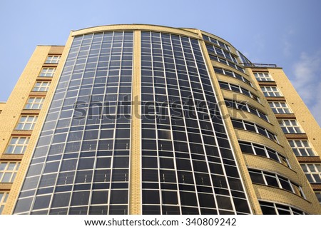 building of glass and bricks. a new high-rise office building of glass and yellow brick, bottom view