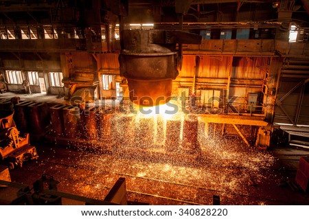 from ladle pours red-hot steel Royalty-Free Stock Photo #340828220