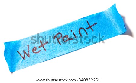 Blue painters tape with Wet Paint written on it isolated on white background