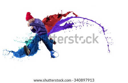 Young male dancer in jump on white background with colorful paint plashes