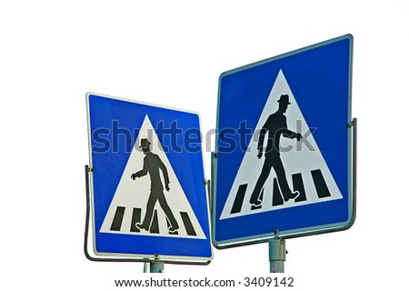 Two of zebra crossing traffic signs showing into opposite directions.
