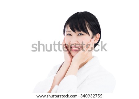 young woman in white bathrobe, isolated on white background