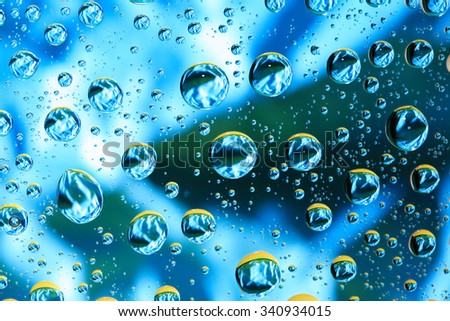 Universe concept. Abstract blue background with various water drops