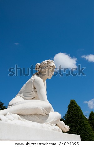 White artistic historical sculpture in paris royal palace park