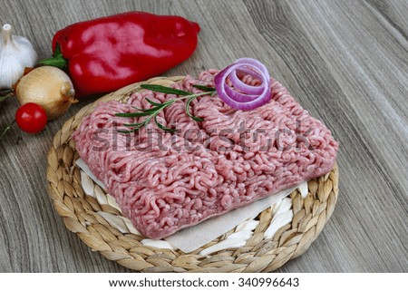 Raw minced pork meat with onion and rosemary ready for cooking