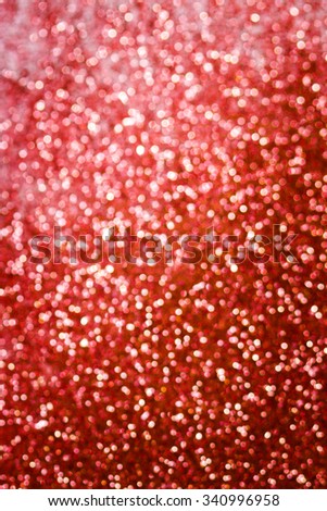 Christmas Background. Red Holiday glowing Abstract Glitter Defocused Background With Blinking Stars. Blurred Bokeh