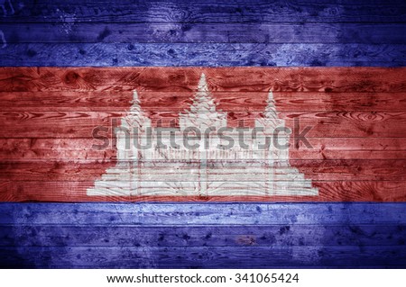 A vignetted background image of the flag of Cambodia painted onto wooden boards of a wall or floor.