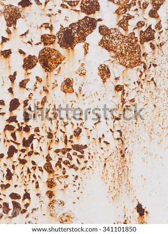 white painted rough rusty old iron surface with cracks and peeling paint