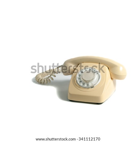 Retro yellow phone isolated on white background.