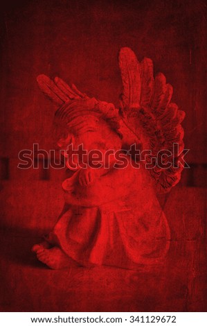 Dreaming christmas angel in red.