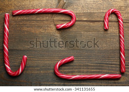 yummy Christmas candy on wooden brown background