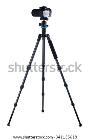 Photo camera on tripod isolated over white background Royalty-Free Stock Photo #341135618
