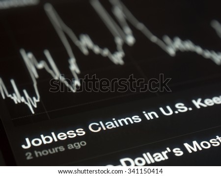 USA Jobless graph on a tablet screen Royalty-Free Stock Photo #341150414