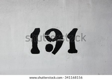 Painted rust metal wall with number 