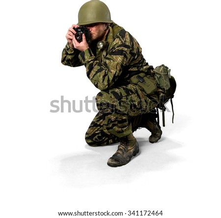 Serious Caucasian man in uniform using camera - Isolated