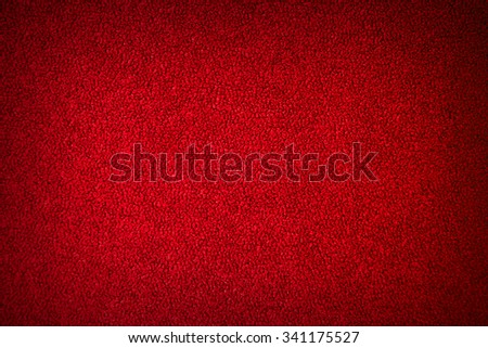 Abstract red textured background. Texture of the pile fabric closeup. Can be used for decoration of Christmas, Valentine's day 