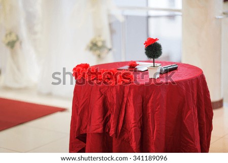 The red table for a wedding ceremony.