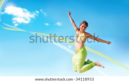 happy bikini woman with a sarong jumping