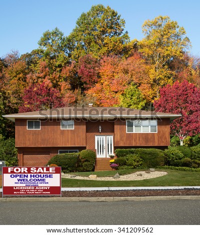 Real estate for sale open house welcome sign Beautiful High Ranch Wood Siding Autumn Fall Day Residential Neighborhood USA