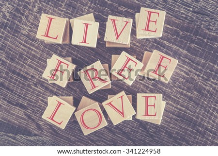 Live Free Love Free message. Cross processed image with shallow depth of field