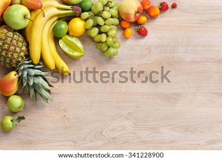 Healthy eating background / studio photography of different fruits on wooden table. High resolution product.
