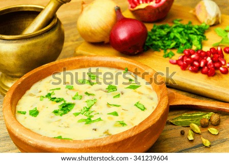 Healthy and Diet Food: Soup of Fish with Pomegranate. Studio Photo