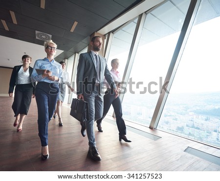business team, businesspeople  group walking at modern bright office interior Royalty-Free Stock Photo #341257523