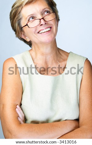 Mid adult woman looking up and smiling
