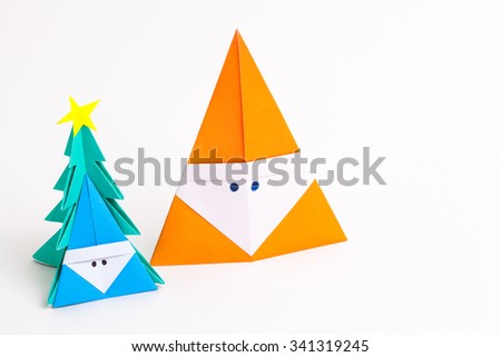 Origami Santa Claus paper craft with christmas trees and a merry