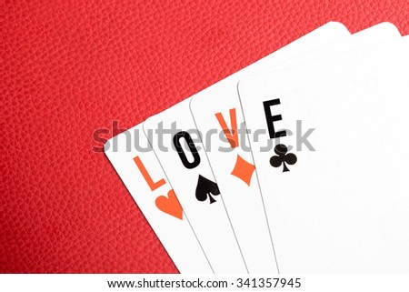 Playing cards with "LOVE" text Royalty-Free Stock Photo #341357945
