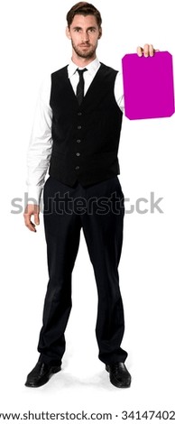 Serious Caucasian man with short dark brown hair in business formal outfit holding medium sign - Isolated