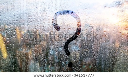 the inscription "question mark" on the sweaty glass. Autumn rain, 