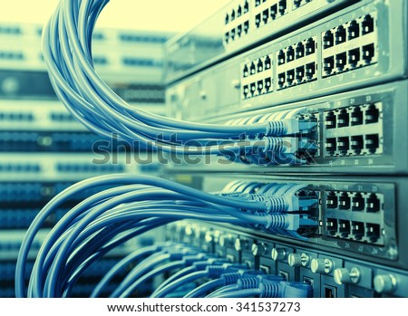 Network panel, switch and cable in data center Royalty-Free Stock Photo #341537273