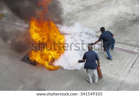 Volunteer try to extinguish the fire Royalty-Free Stock Photo #341549105