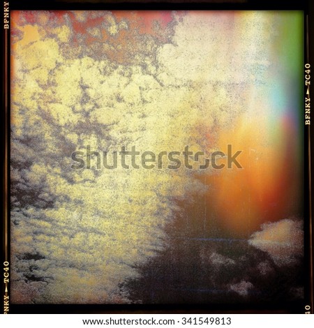 Cloudy summer abstract image in film frame