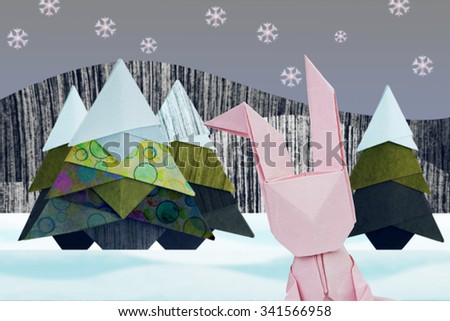Paper origami selfie rabbit in winter christmas fir-tree in snow forest 