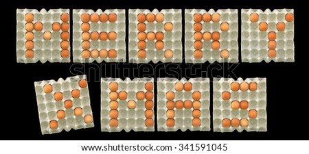 "MERRY X MAS" word from eggs isolated on black background for Christmas decorative.
