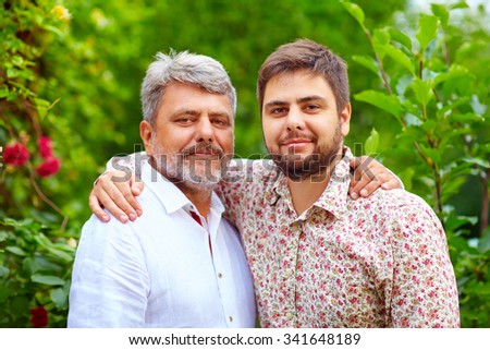 portrait of happy father and son, that are similar in appearance Royalty-Free Stock Photo #341648189