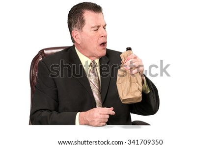 Serious Caucasian elderly man with short medium brown hair in business formal outfit holding office chair - Isolated