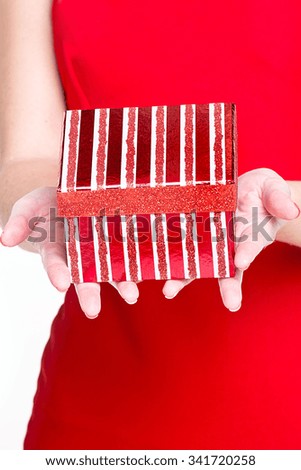 Gift box in woman hand - christmas present, isolated