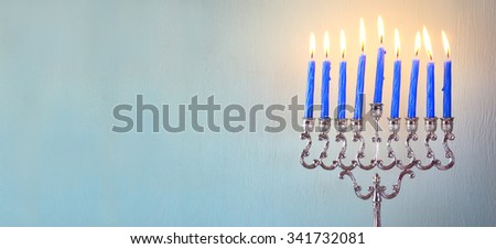 website banner image of jewish holiday Hanukkah with menorah (traditional Candelabra)