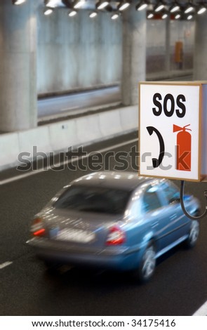 Roadside SOS Sign in a Highway Tunnel