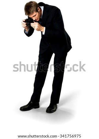 Serious Caucasian man with short medium blond hair in business formal outfit using camera - Isolated